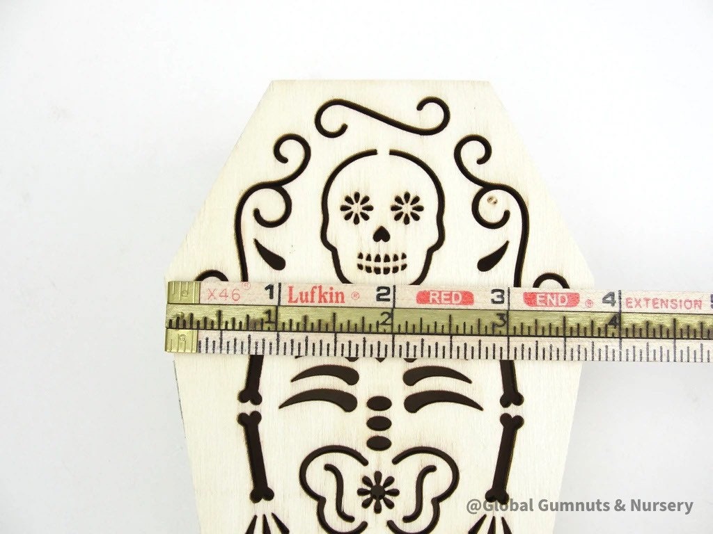 Wooden coffin, perfect for Halloween décor featuring sugar skull or skeleton themes.
