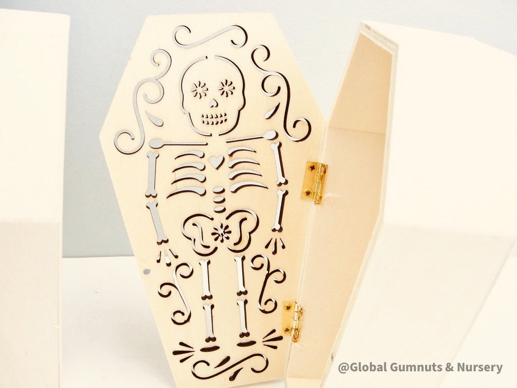 Wooden coffin, perfect for Halloween décor featuring sugar skull or skeleton themes.
