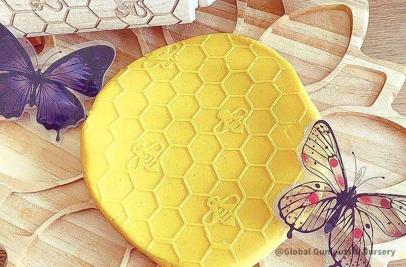 Honeycomb & Bees Rolling Pin: Wooden rolling pin with honeybee pattern for baking and crafting.