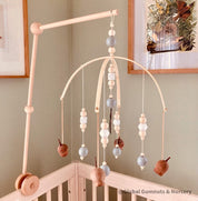 Mobile Arms Nursery Attachment: Wooden mobile hanger arms for cribs or nursery displays, designed to hang decorative items securely.