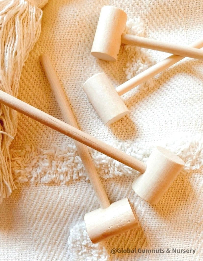 Child Wooden Hammer: Child-sized wooden hammer for sensory and motor skills development.