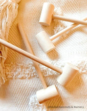 Child Wooden Hammer: Child-sized wooden hammer for sensory and motor skills development.