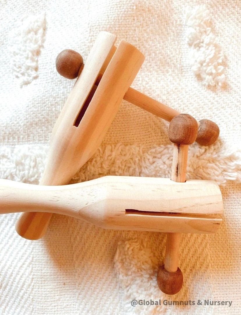 Tik Tok wooden shaker, a handmade musical instrument.
