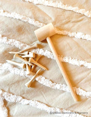 Child Wooden Hammer: Child-sized wooden hammer for sensory and motor skills development.