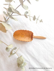 Natural Wood Leaf Spoon: Wooden scoop shaped like a leaf for sensory and craft play.