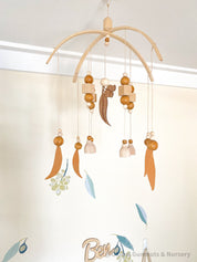 Australian Felt Gumleaf Mobile: Handmade Australian gumleaf mobile with dark wooden beads, inspired by native nature.