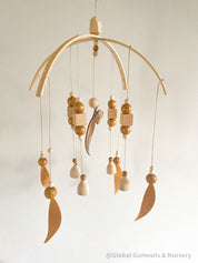 Australian Felt Gumleaf Mobile: Handmade Australian gumleaf mobile with dark wooden beads, inspired by native nature.