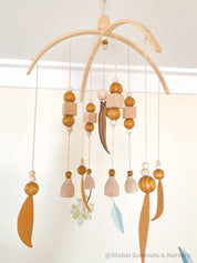 Australian Felt Gumleaf Mobile: Handmade Australian gumleaf mobile with dark wooden beads, inspired by native nature.