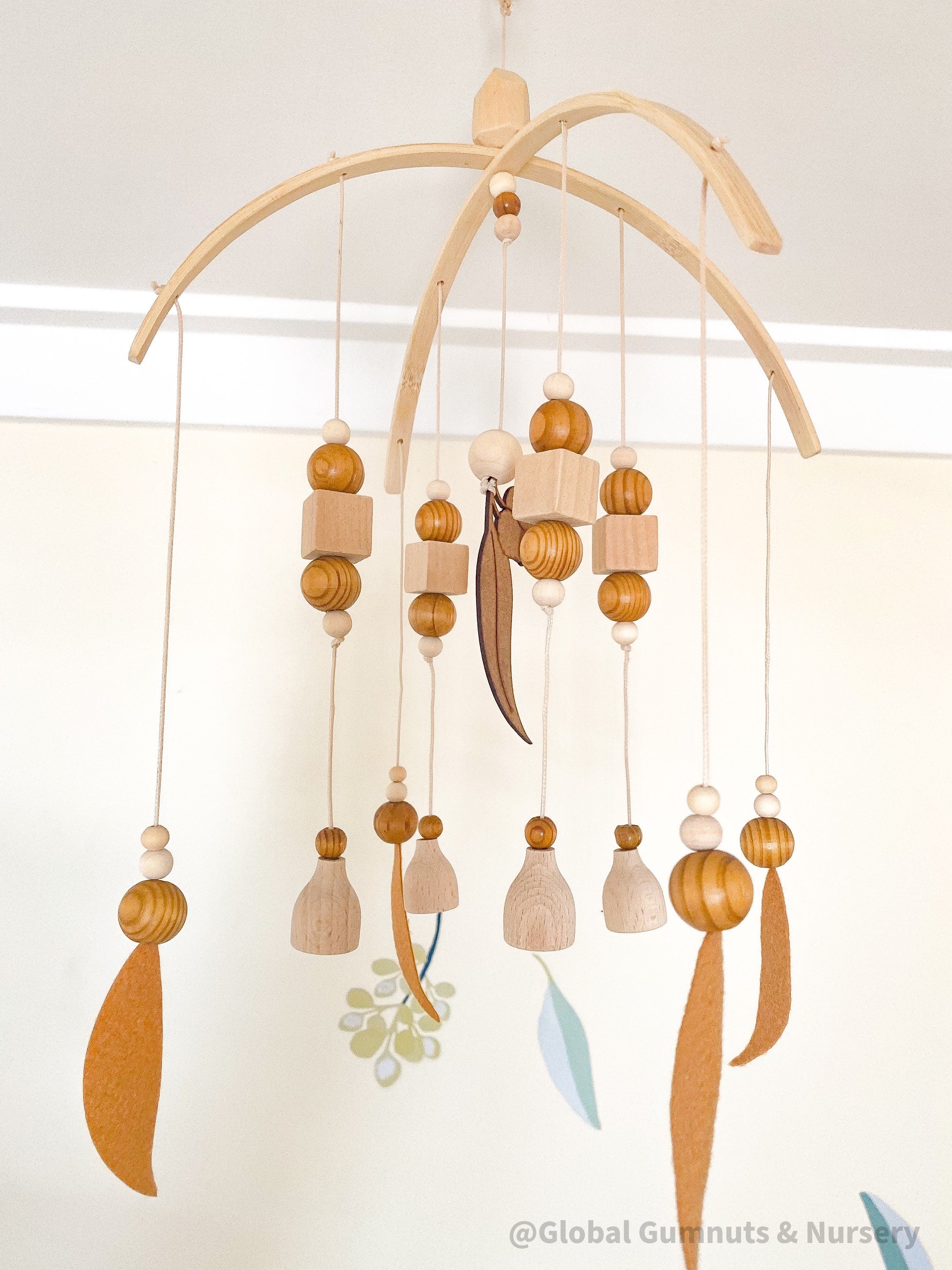 Australian Felt Gumleaf Mobile: Handmade Australian gumleaf mobile with dark wooden beads, inspired by native nature.