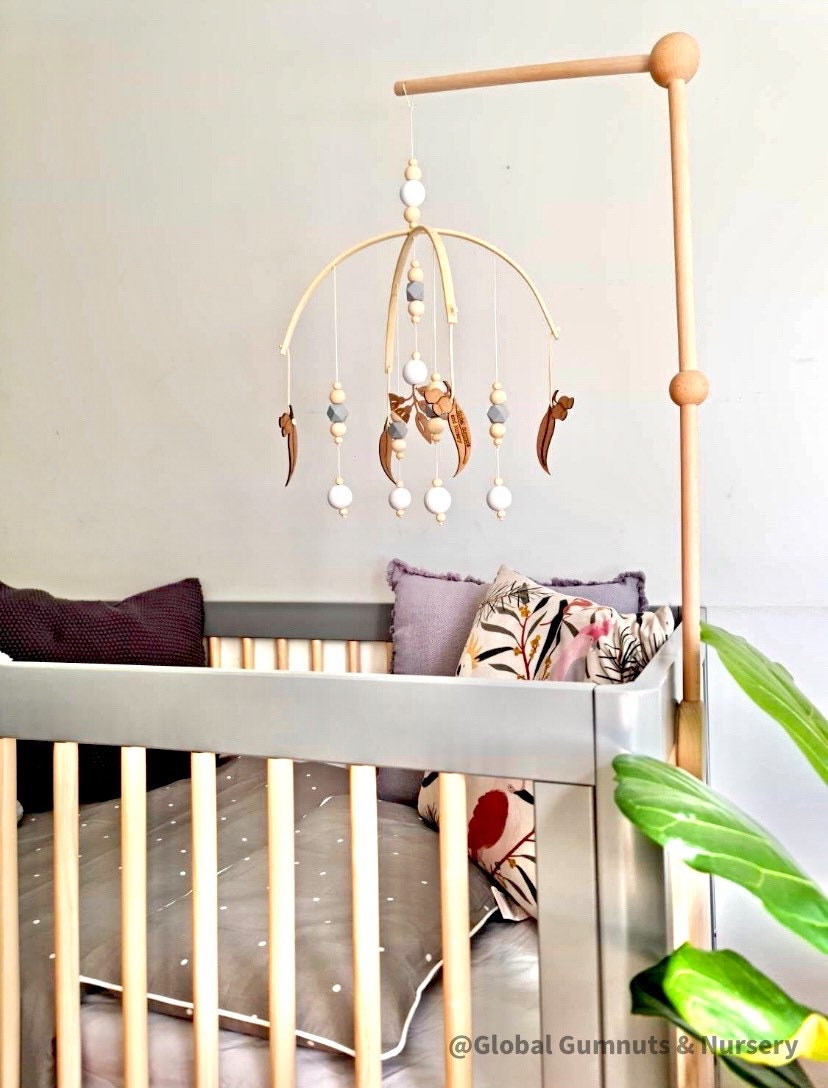 Mobile Arms Nursery Attachment: Wooden mobile hanger arms for cribs or nursery displays, designed to hang decorative items securely.