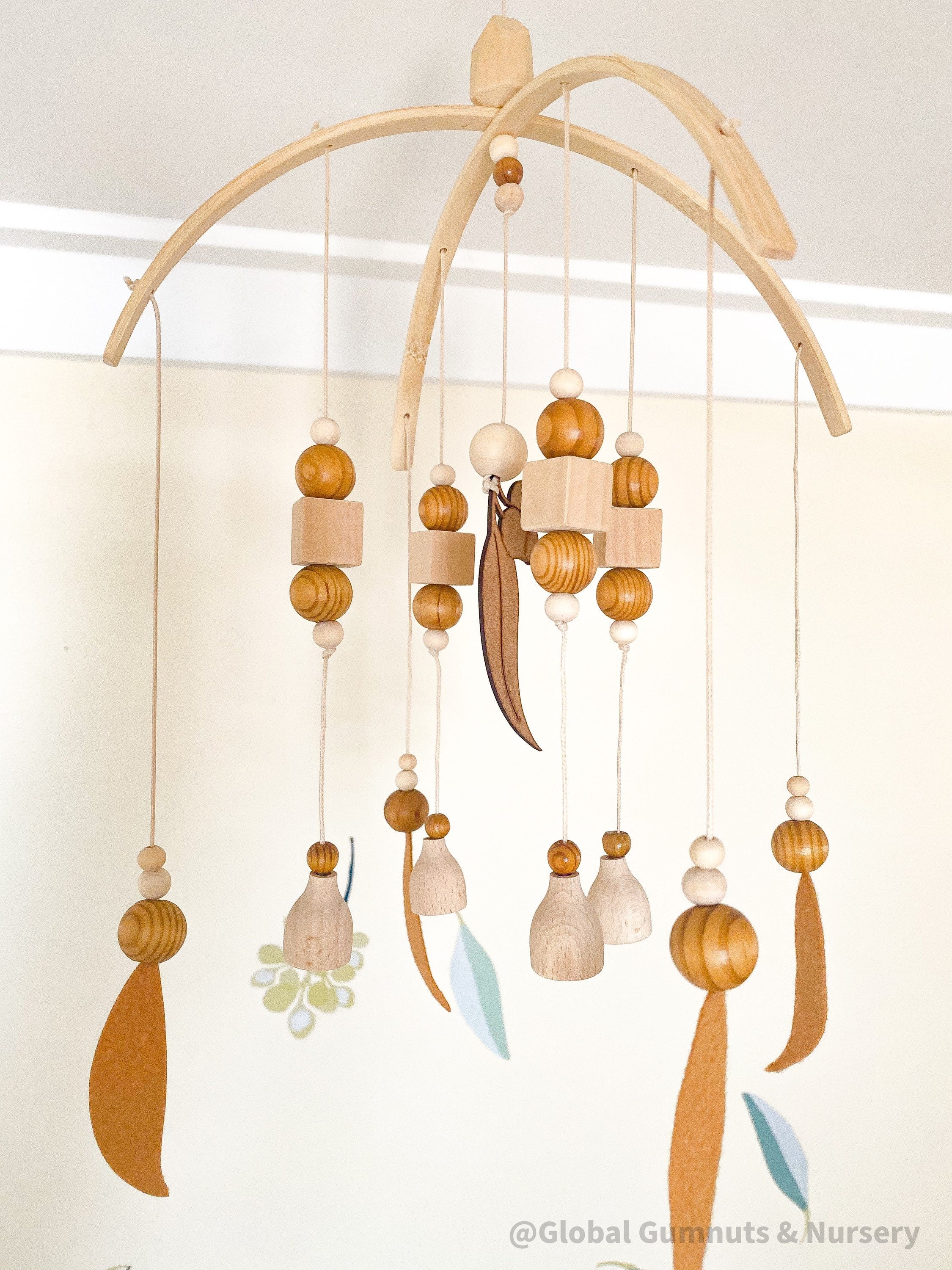 Australian Felt Gumleaf Mobile: Handmade Australian gumleaf mobile with dark wooden beads, inspired by native nature.