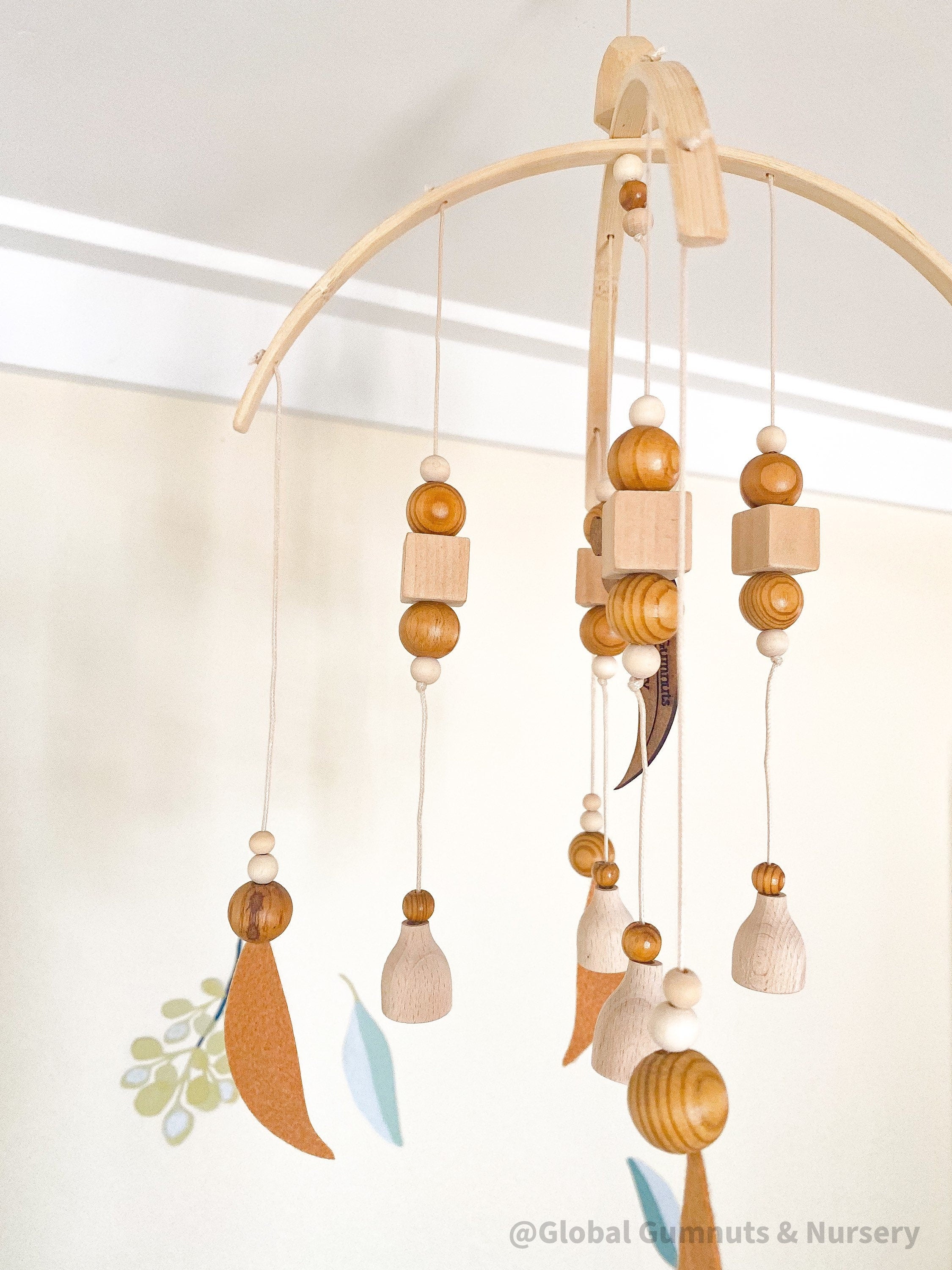 Australian Felt Gumleaf Mobile: Handmade Australian gumleaf mobile with dark wooden beads, inspired by native nature.