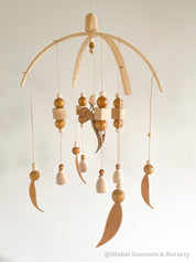 Australian Felt Gumleaf Mobile: Handmade Australian gumleaf mobile with dark wooden beads, inspired by native nature.