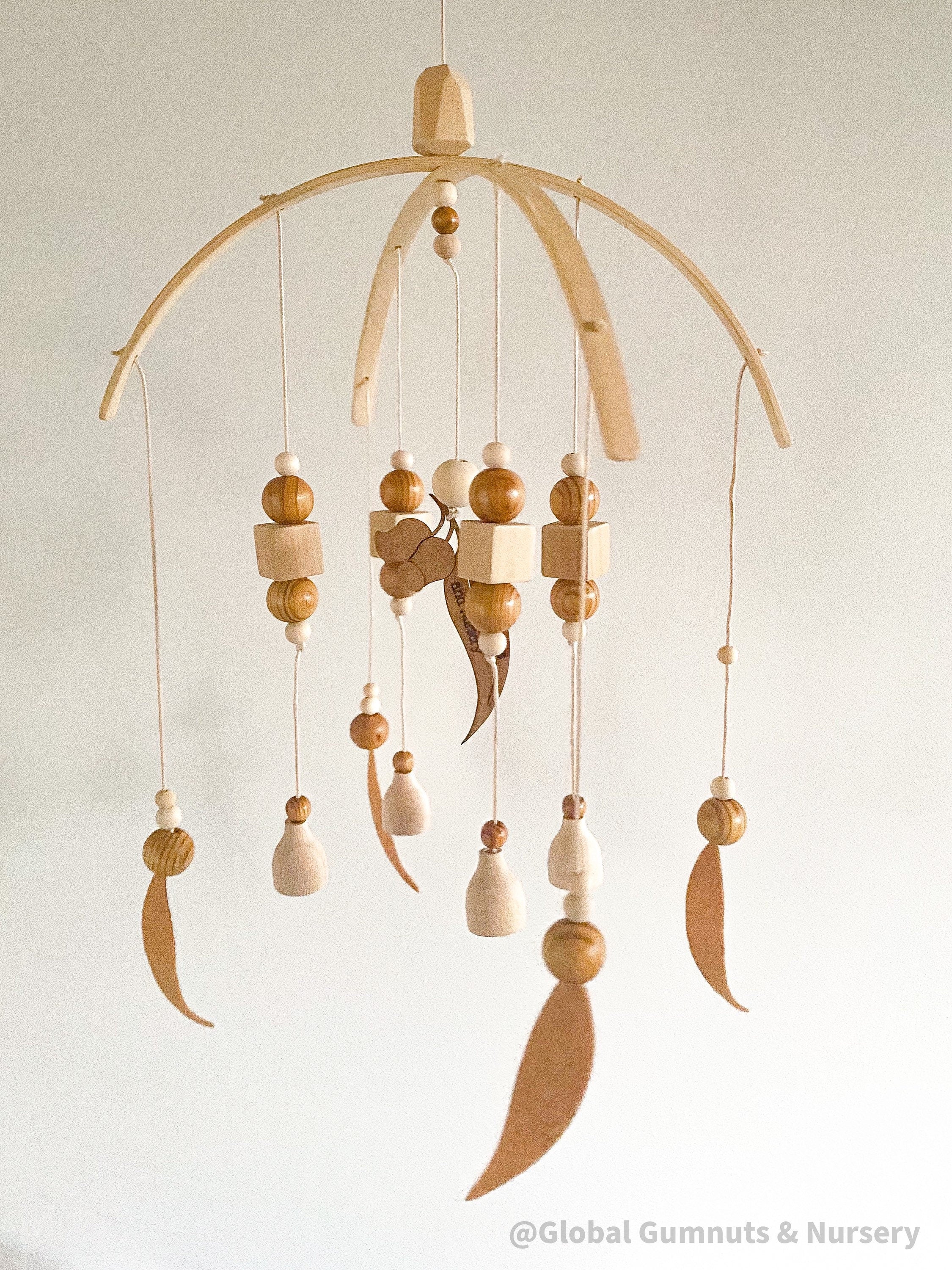Australian Felt Gumleaf Mobile: Handmade Australian gumleaf mobile with dark wooden beads, inspired by native nature.