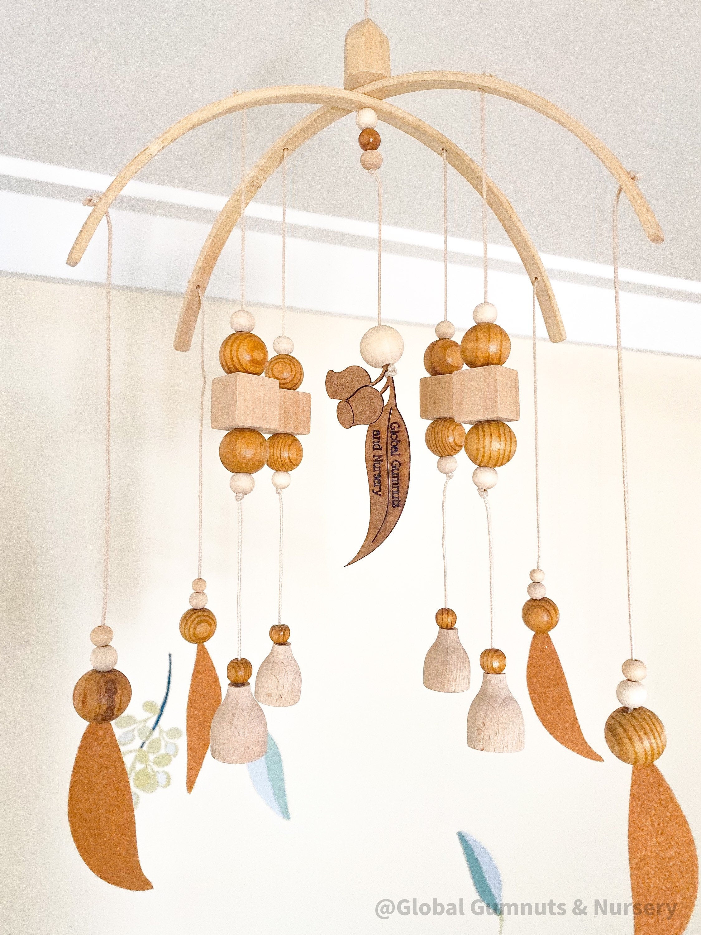 Australian Felt Gumleaf Mobile: Handmade Australian gumleaf mobile with dark wooden beads, inspired by native nature.