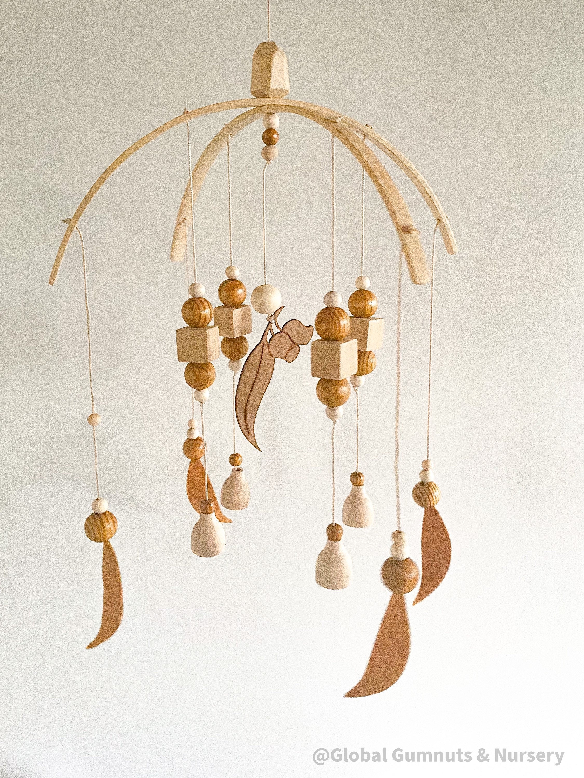 australian felt gumleaf mobile: handmade australian gumleaf mobile with dark wooden beads, inspired by native nature.
