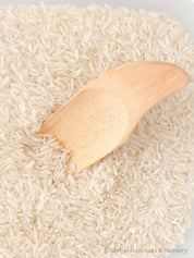 Flat rectangle scooper made of natural wood, perfect for sensory play and Montessori activities.