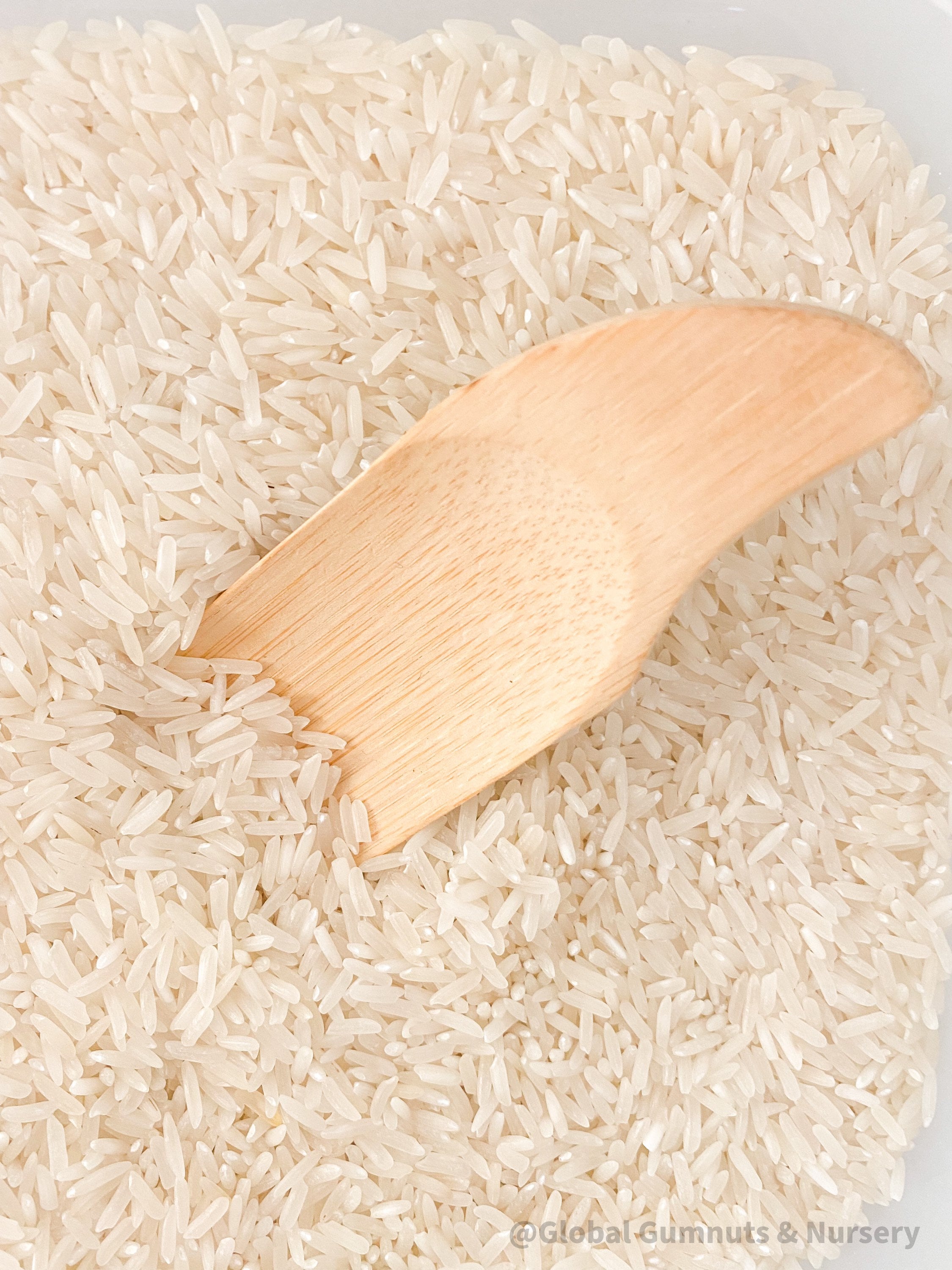 Flat rectangle scooper made of natural wood, perfect for sensory play and Montessori activities.