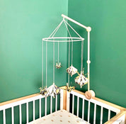 Mobile Arms Nursery Attachment: Wooden mobile hanger arms for cribs or nursery displays, designed to hang decorative items securely.