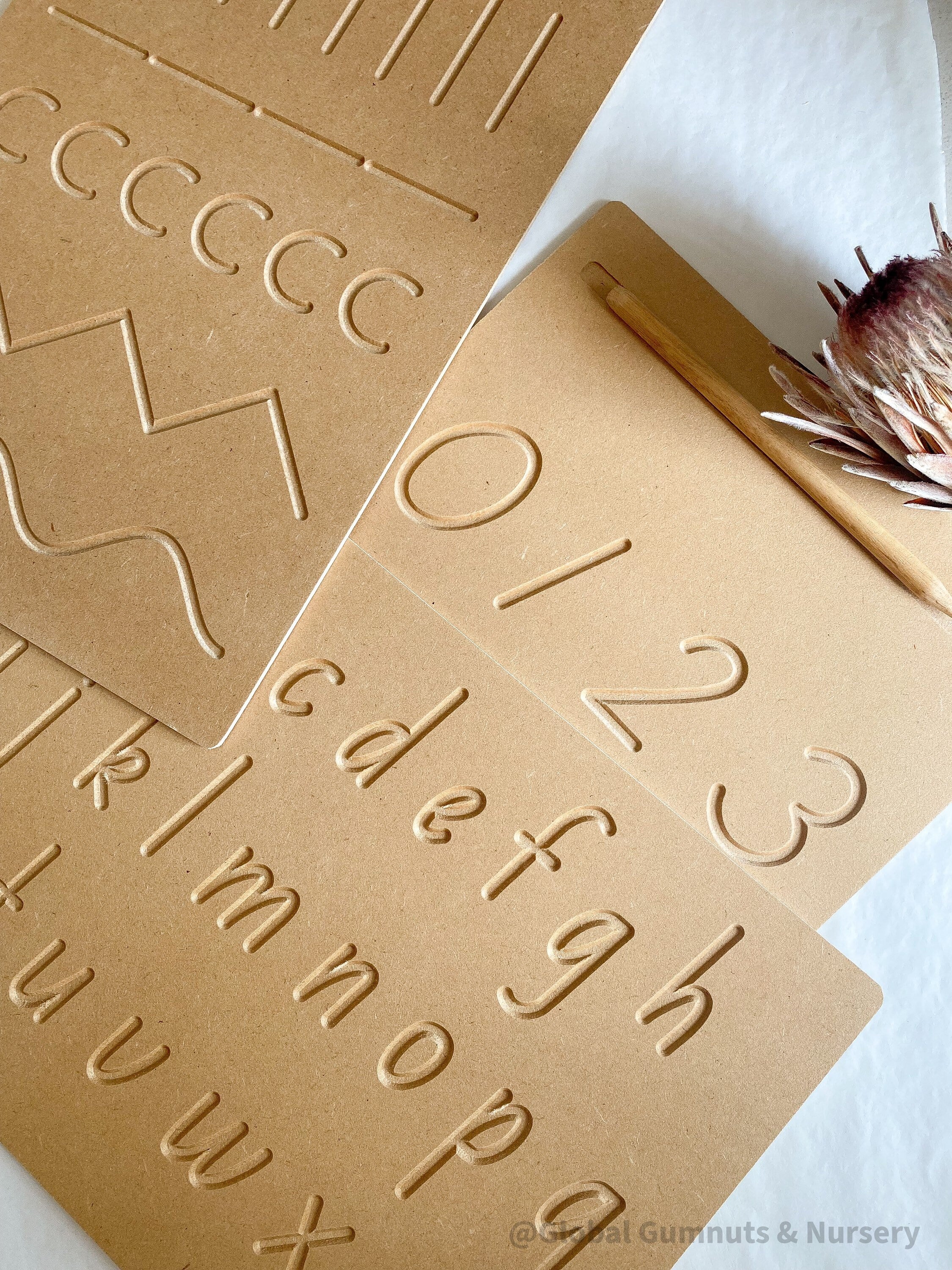 NUMBERS 0-9 Tracing Board: Montessori-style wooden tracing board with a stylus, helping children learn to trace and recognize numbers.