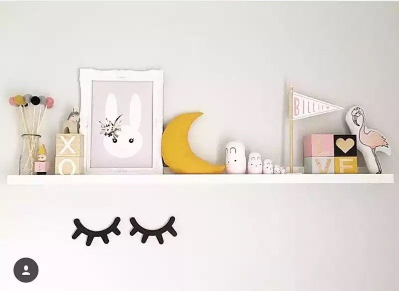 Sleepy eyes decor, a whimsical touch for nursery or kids' rooms.