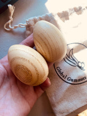 Wooden egg shakers, available individually or as a set of 2, perfect for Easter or musical fun.
