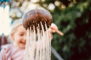 Short handle sand or water scoop, a kid-friendly tool for mud kitchens or play.
