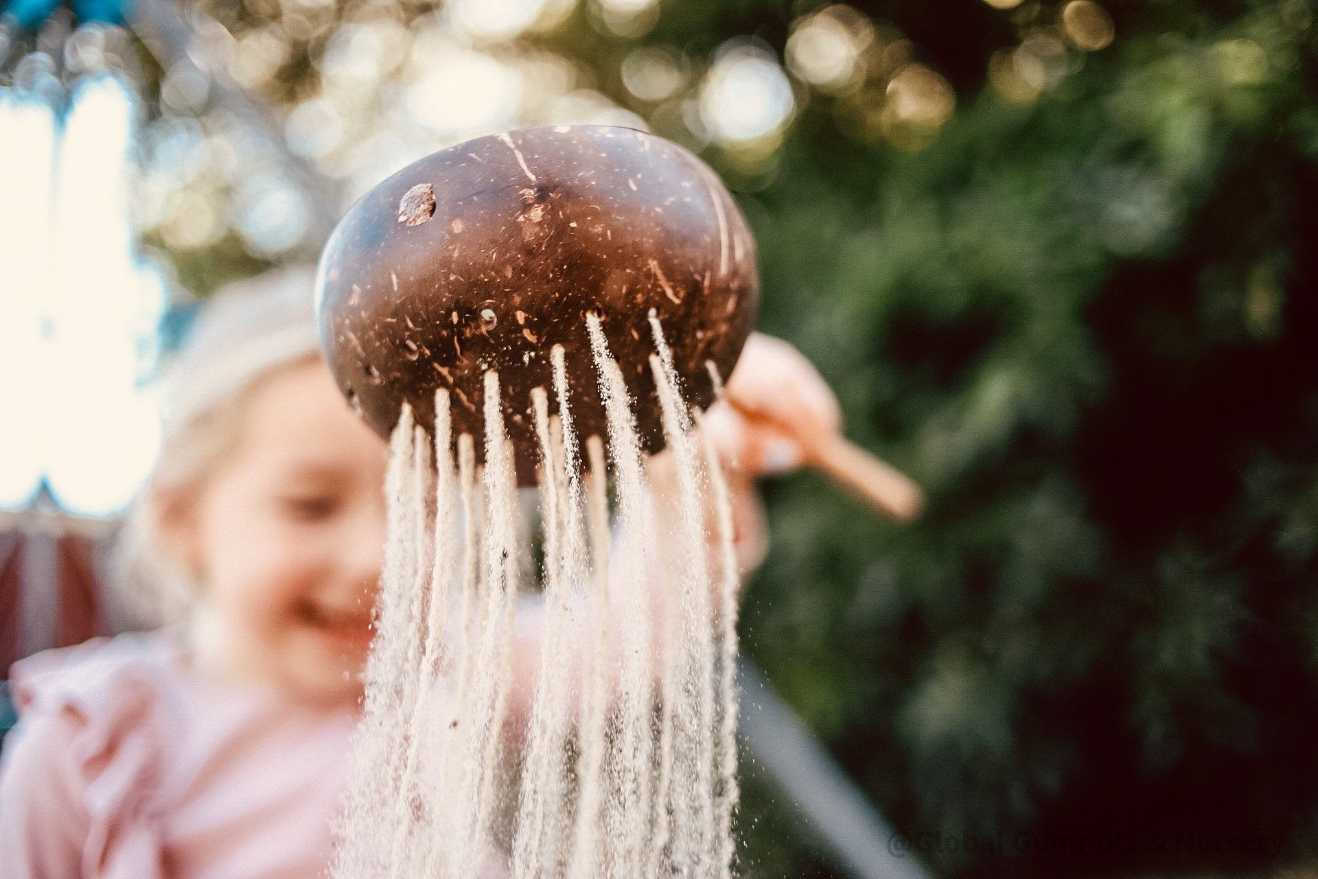 Short handle sand or water scoop, a kid-friendly tool for mud kitchens or play.
