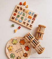 Wooden rainmaker toy in two sizes, a magical sensory and musical toy for kids.