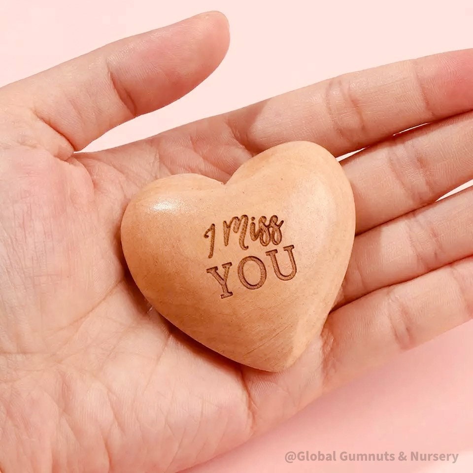 Gift a wooden heart with "I Miss You" sentiment, a thoughtful keepsake to send love and warm wishes.