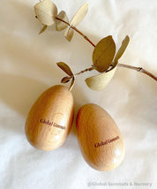 Wooden egg shakers, available individually or as a set of 2, perfect for Easter or musical fun.
