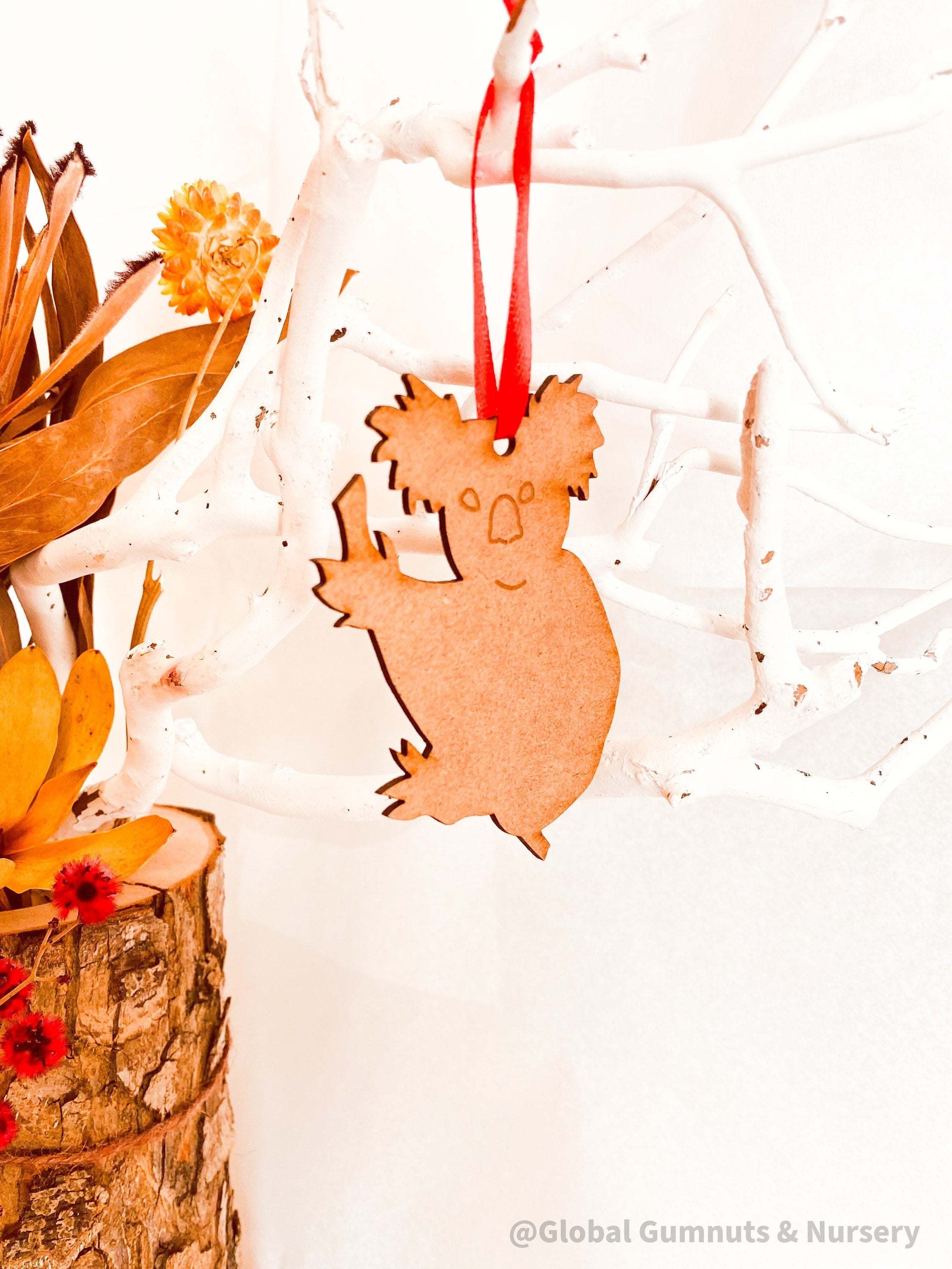 Koala Christmas Ornament: Wooden koala ornament for festive Australian-themed decor.