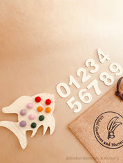 rainbow fish tens board: montessori-style tens board featuring colourful felt balls and wooden numbers, designed for teaching counting and early math skills.