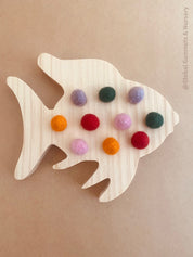rainbow fish tens board: montessori-style tens board featuring colourful felt balls and wooden numbers, designed for teaching counting and early math skills.