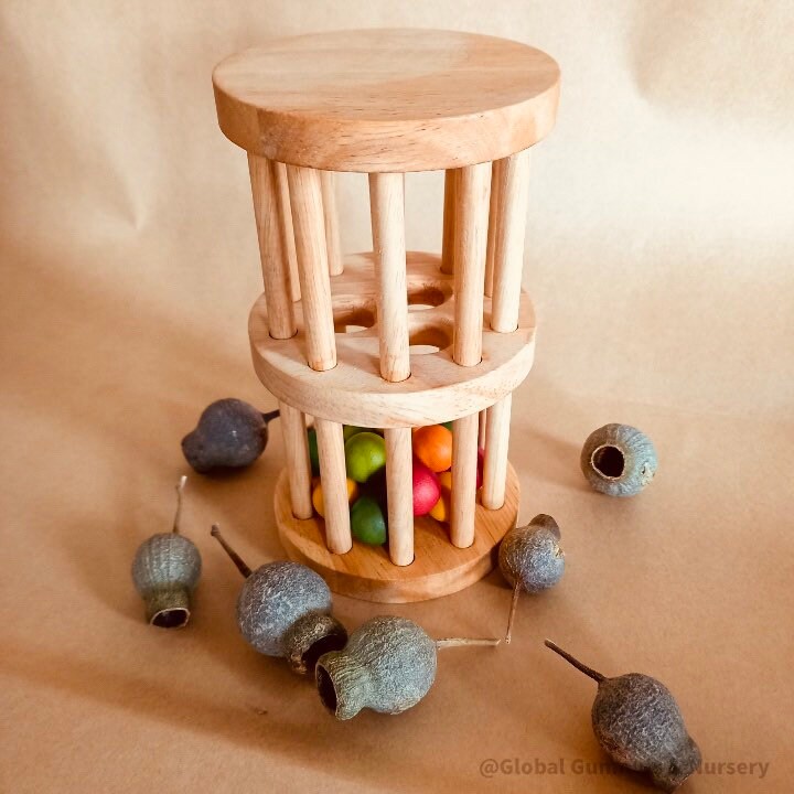 Wooden rainmaker toy in two sizes, a magical sensory and musical toy for kids.