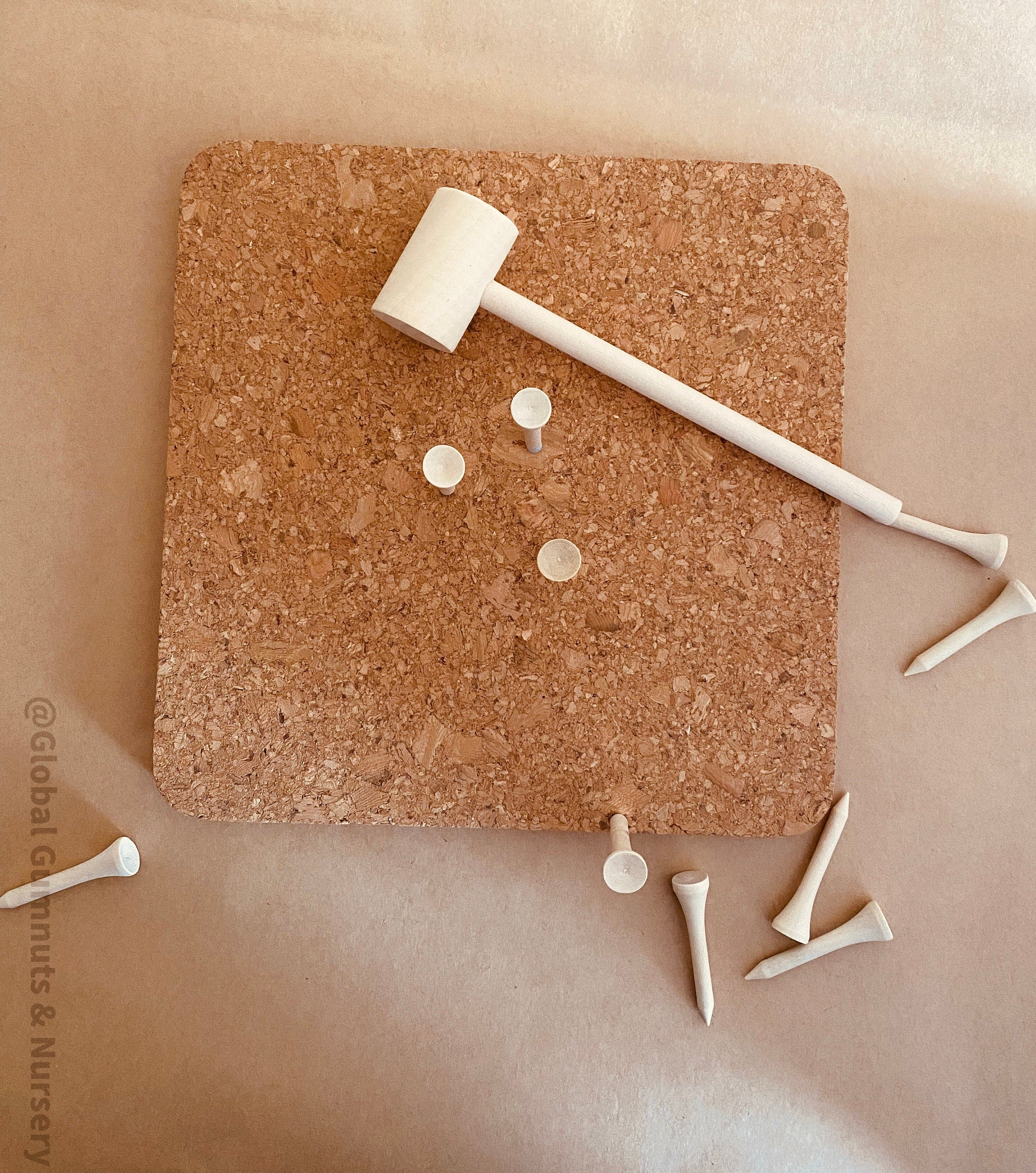CORK and Tools Set: Kids’ wooden hammer and nail set with corkboard and wooden nails for creative crafting and playdough fun.