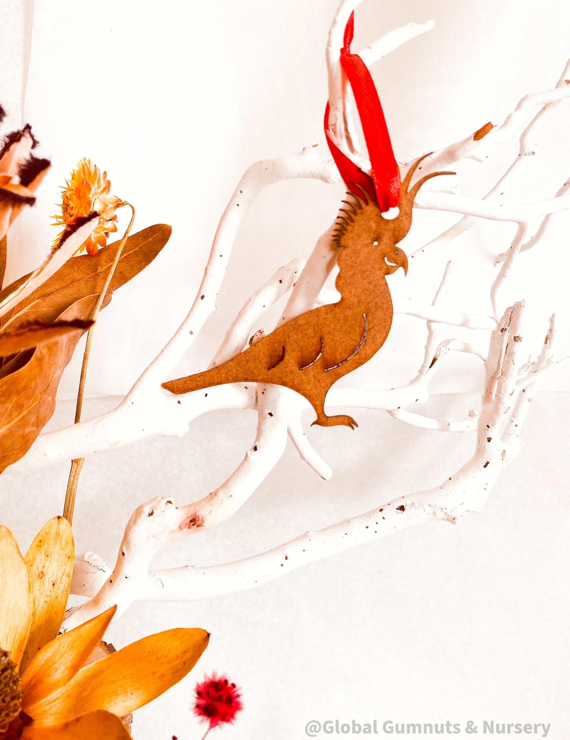 Cockatoo Ornament: Wooden ornament of a cockatoo for Christmas decorations.