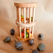 Wooden rainmaker toy in two sizes, a magical sensory and musical toy for kids.