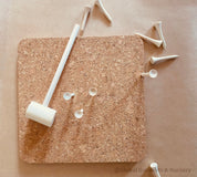 CORK and Tools Set: Kids’ wooden hammer and nail set with corkboard and wooden nails for creative crafting and playdough fun.