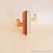 Wooden cactus decor piece, perfect for pretend play or as a cake topper.