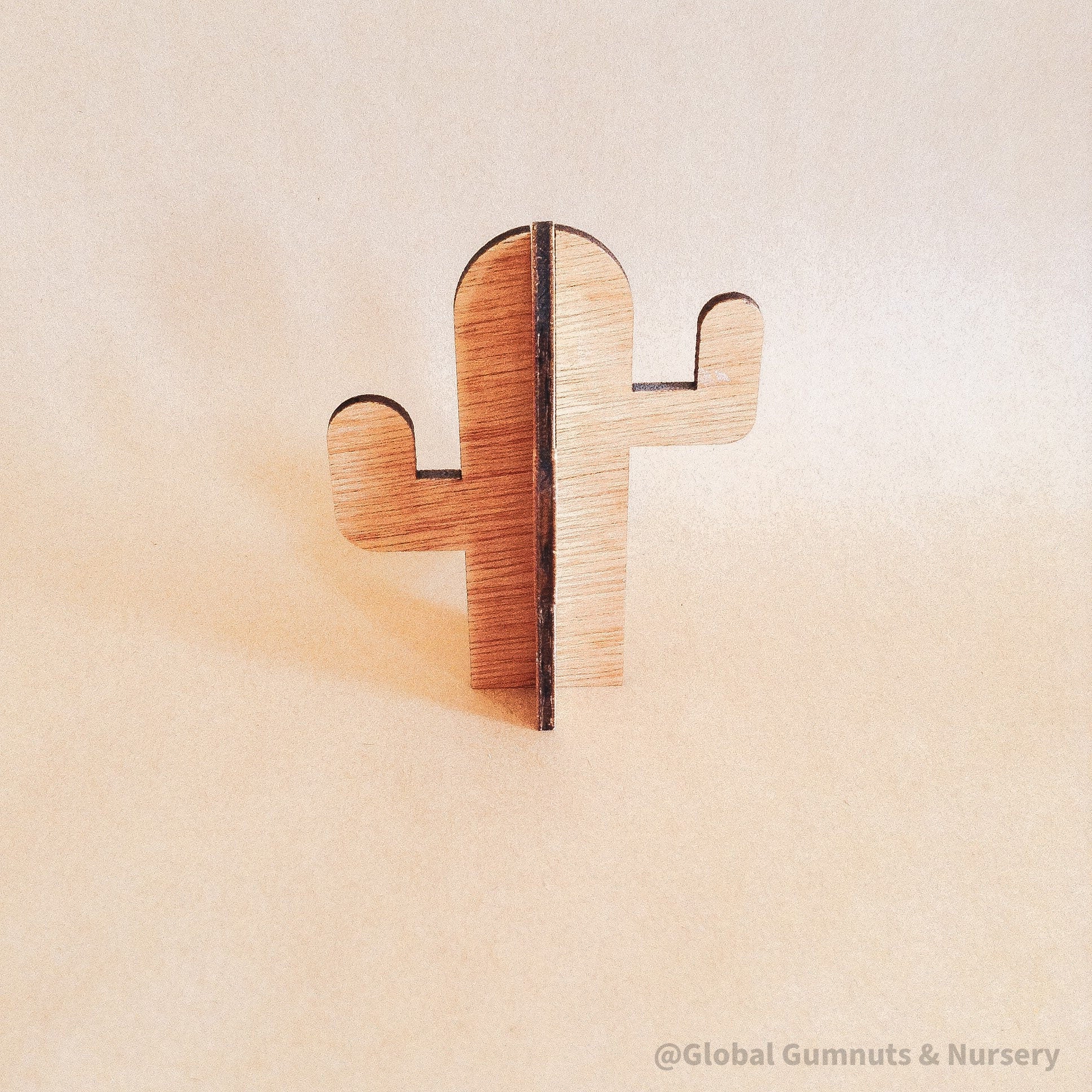 Wooden cactus decor piece, perfect for pretend play or as a cake topper.