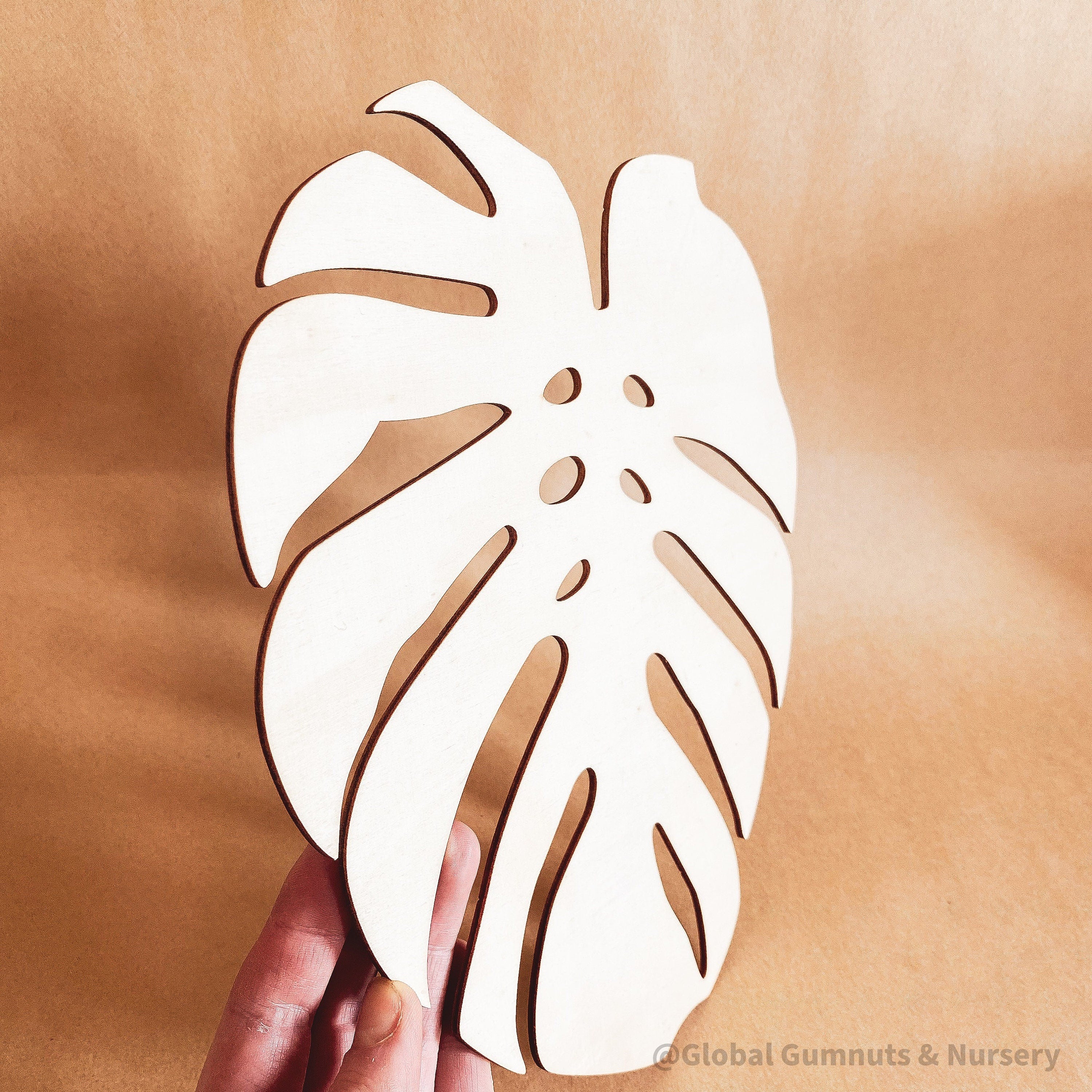 Monstera Leaf: Wooden monstera leaf decor for crafting or home design.