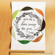 A4-sized "A Home Among the Gumtrees" decor print, perfect for Australian-inspired wall art or nostalgic home accents.