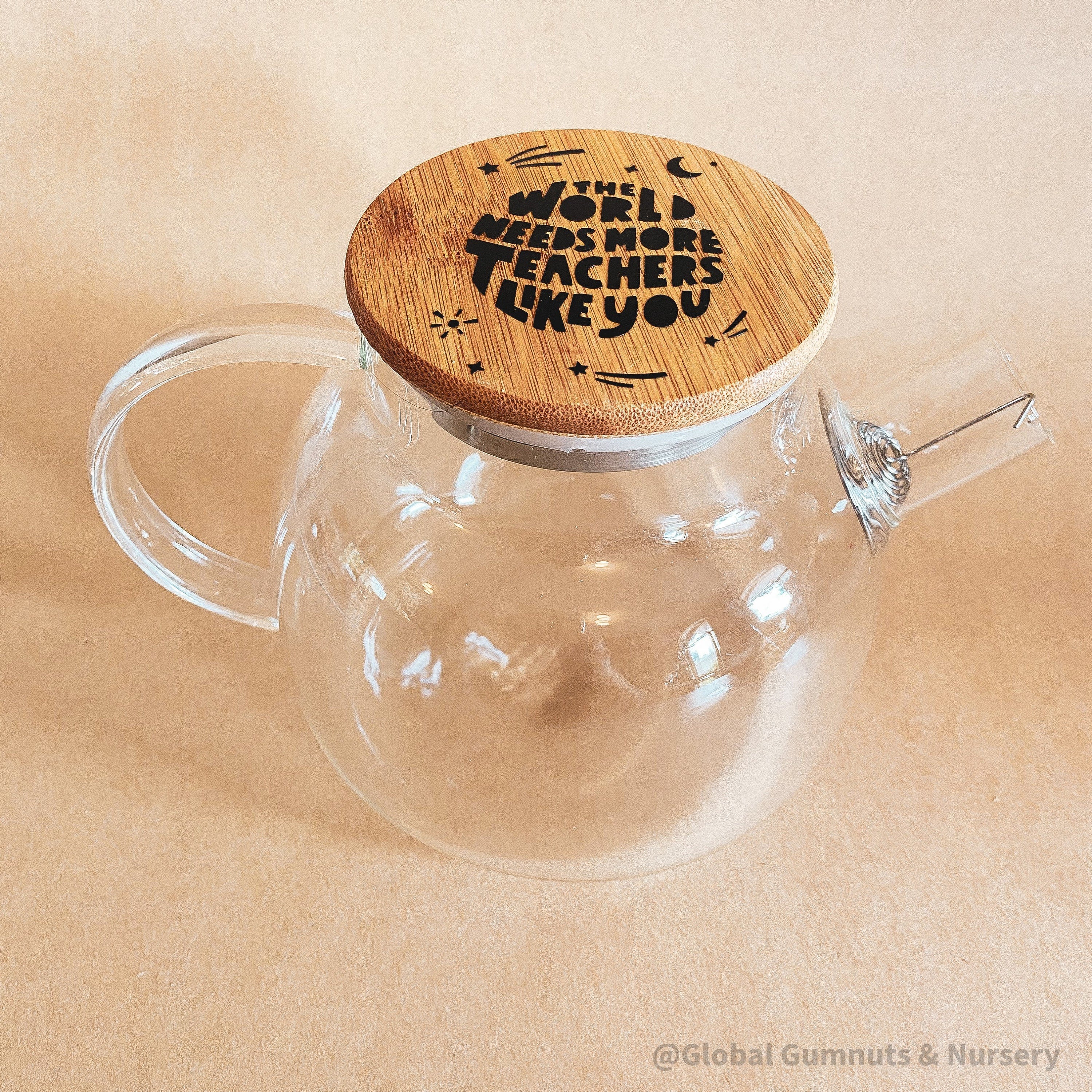 Teacher’s gift glass teapot with wooden lid, Scandi-style elegance for tea time.