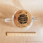 Teacher’s gift glass teapot with wooden lid, Scandi-style elegance for tea time.