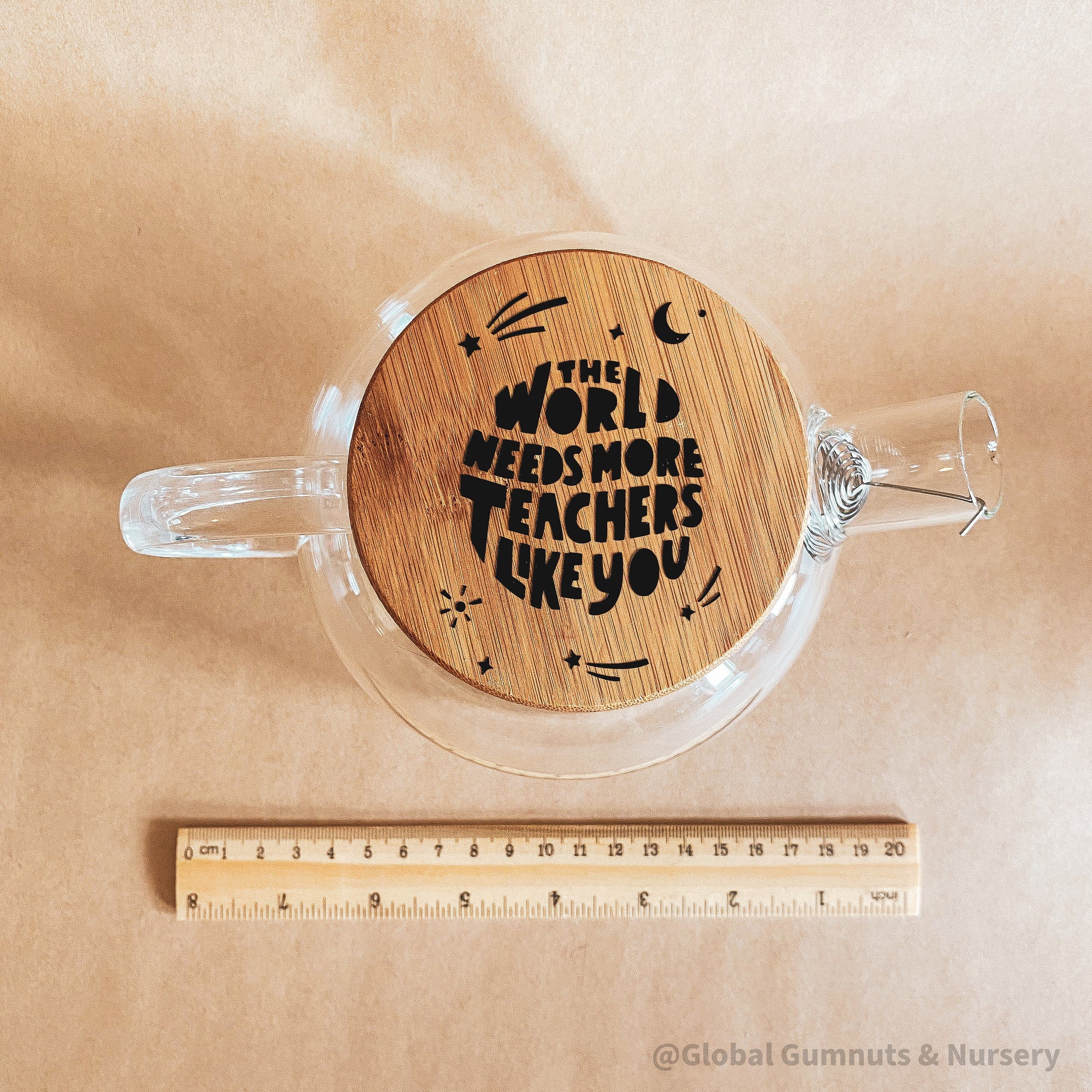 Teacher’s gift glass teapot with wooden lid, Scandi-style elegance for tea time.