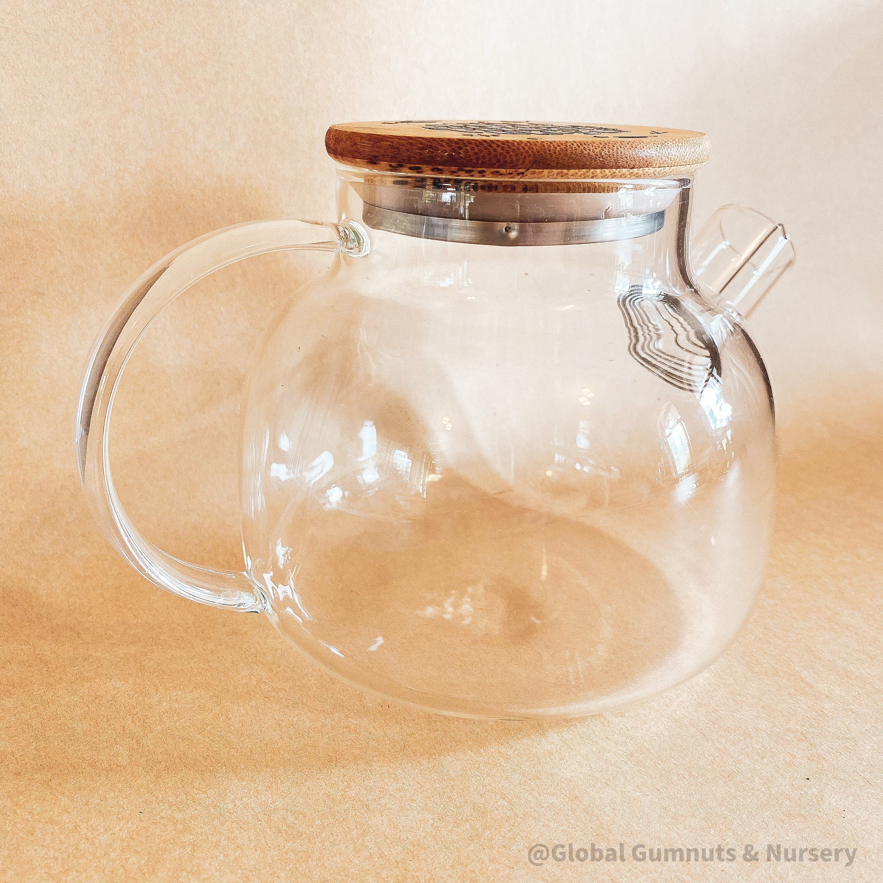 Teacher’s gift glass teapot with wooden lid, Scandi-style elegance for tea time.