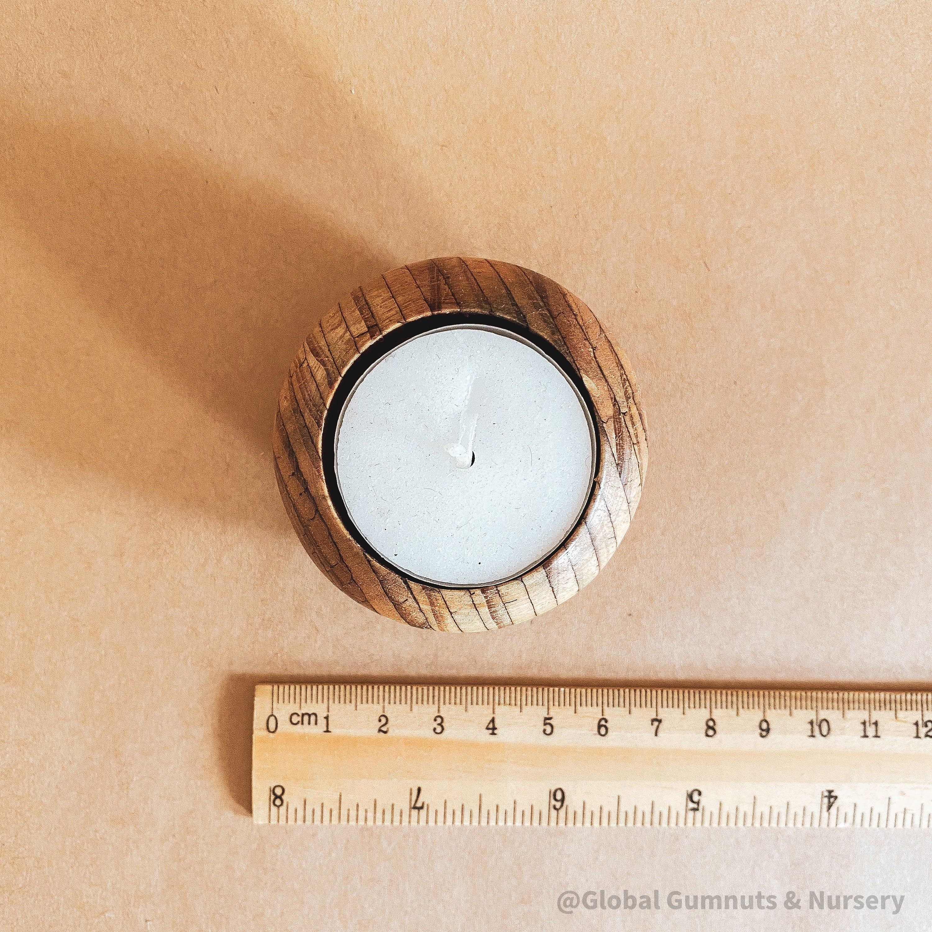 Wooden Tea Light Candle: Simple wooden holder for tealight candles.