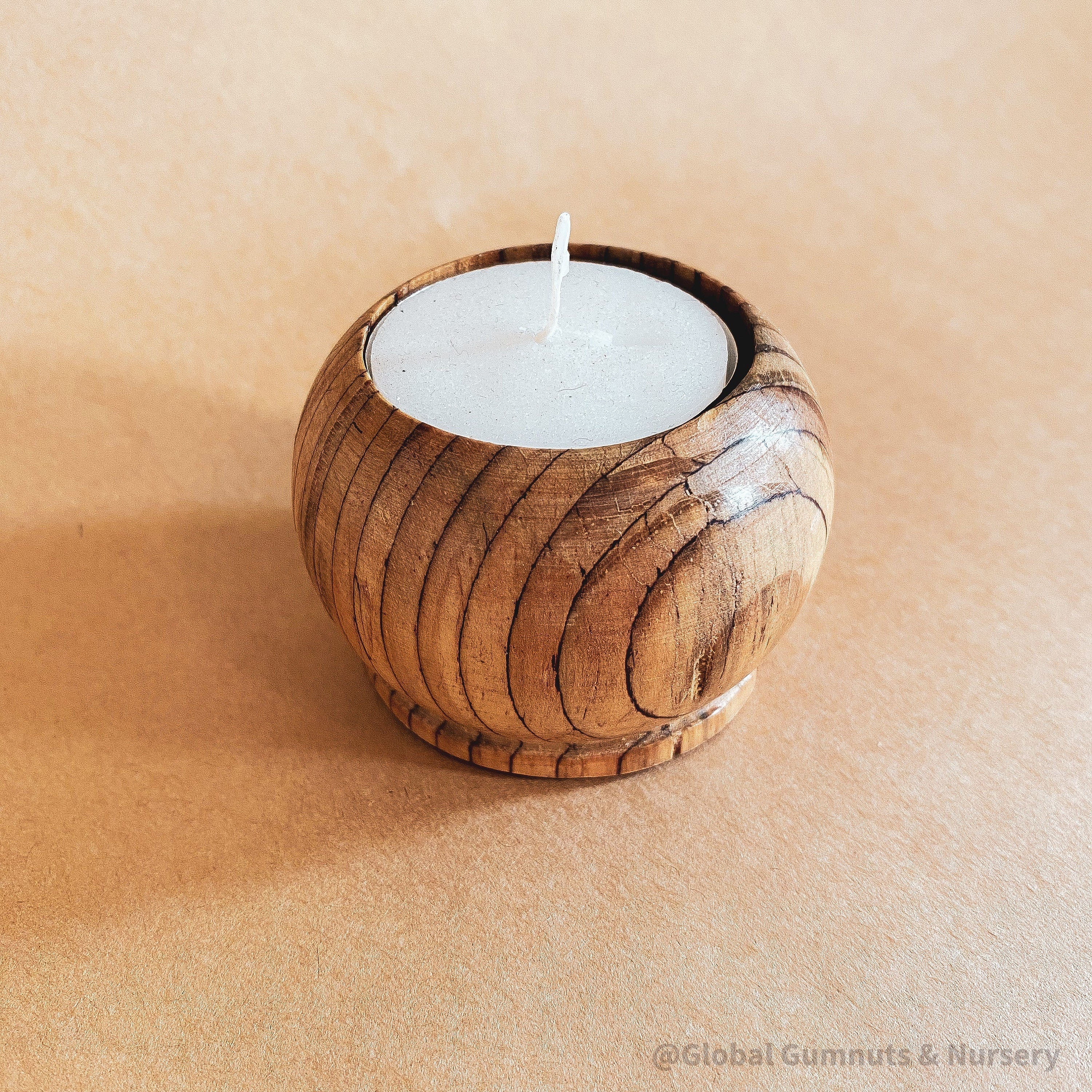 Wooden Tea Light Candle: Simple wooden holder for tealight candles.