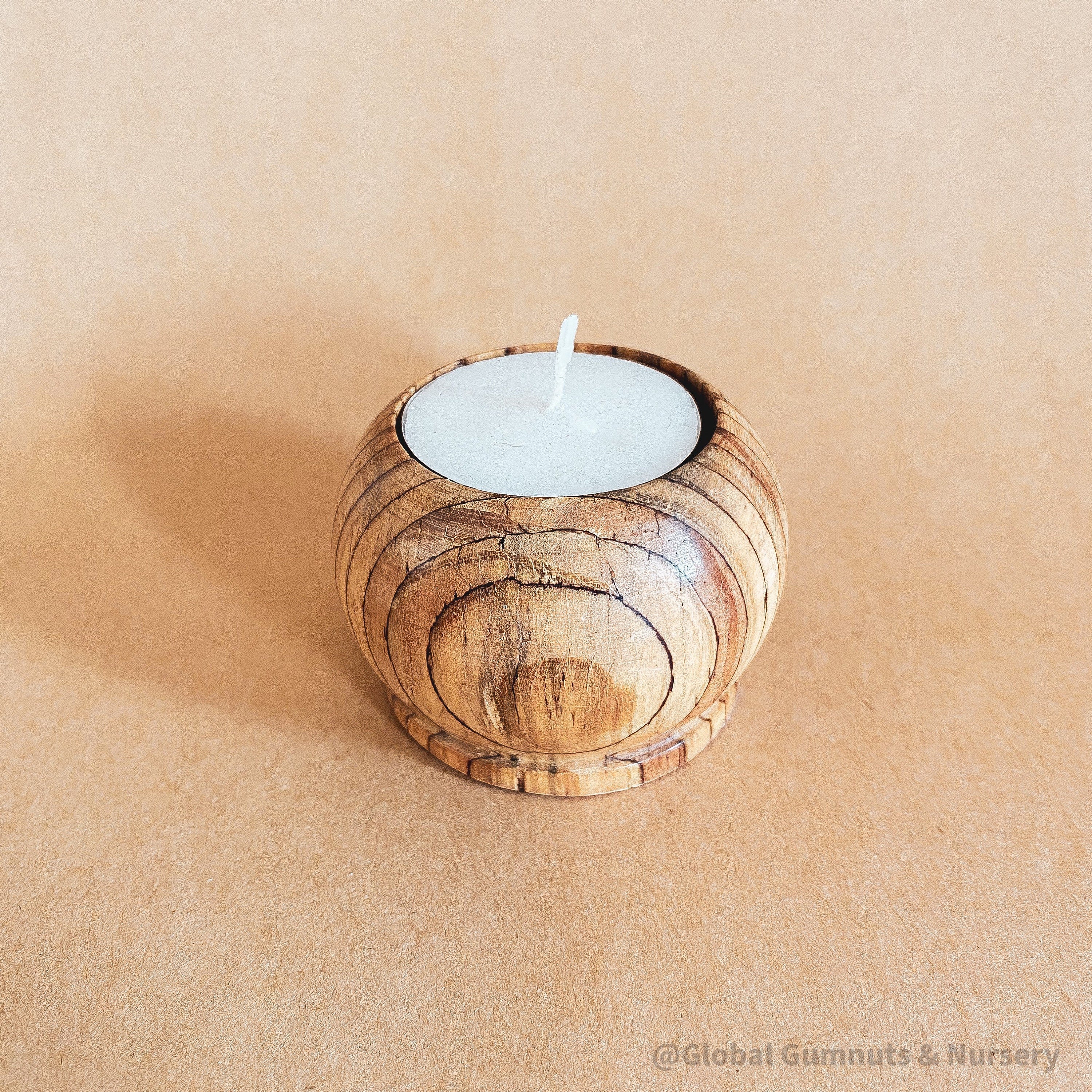 Wooden Tea Light Candle: Simple wooden holder for tealight candles.